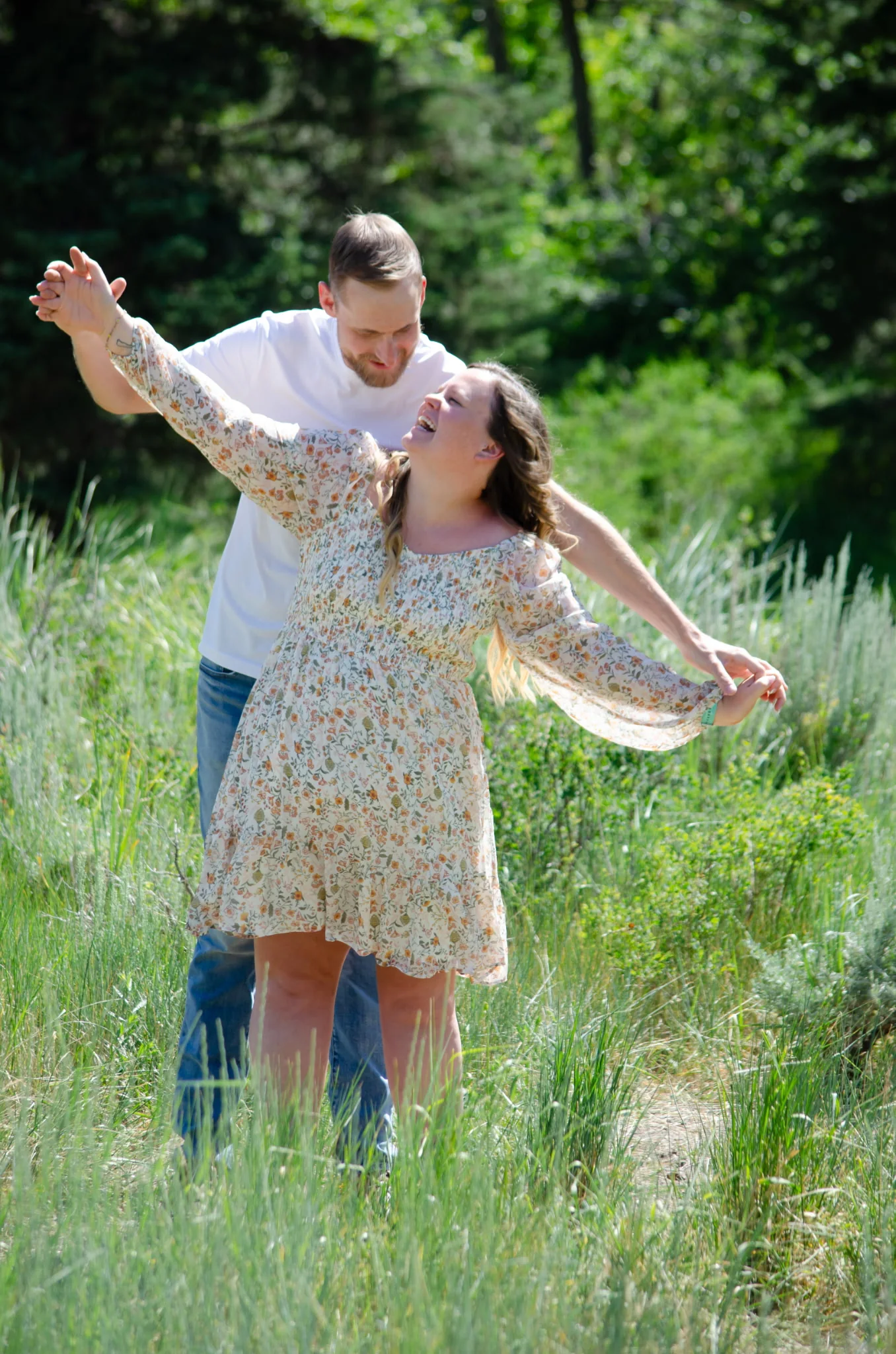 Tiff and Mitch dancing in the meadow