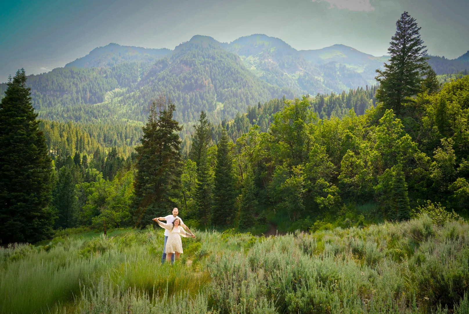 Tiff and Mitch in a wide mountain meadow